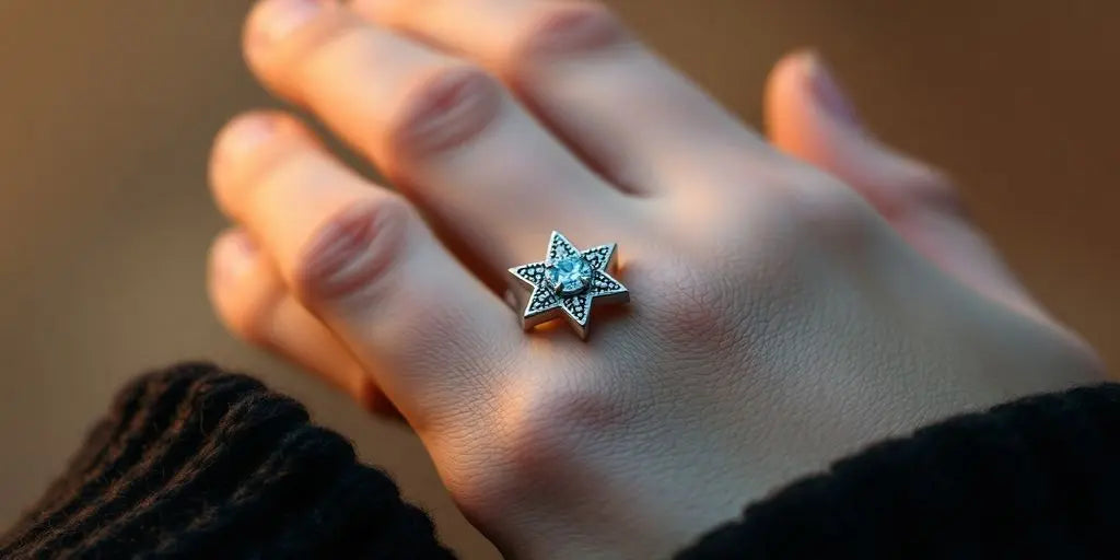 Star pattern ring on a hand.