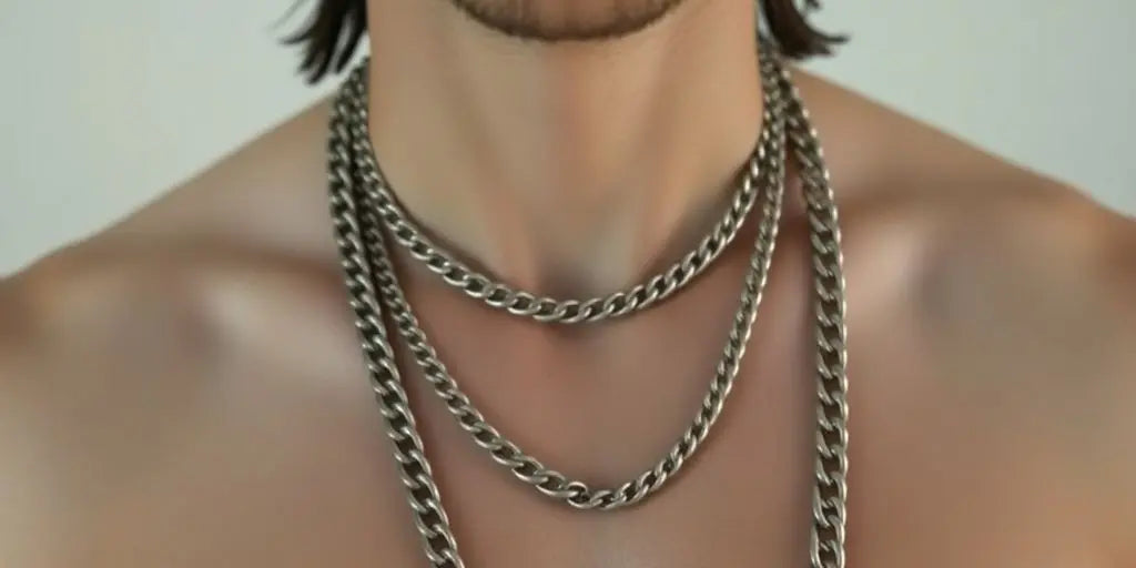 Male model wearing various stylish chains.
