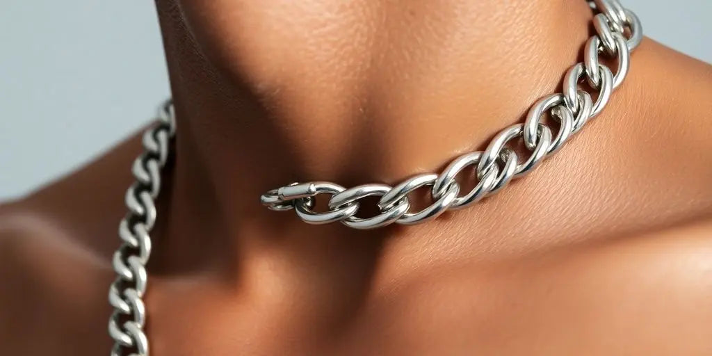 Close-up, 12mm silver Cuban link chain, worn.