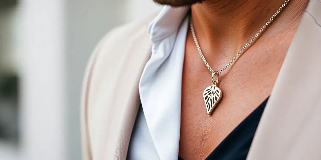 Man in modern fashion wearing a pendant necklace.